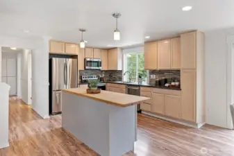 The kitchen is open to both the dining room and living room, allowing for easy entertaining.