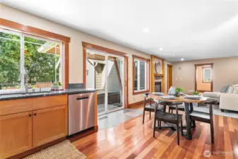 A beautiful view of the backyard, gardens and patio from the kitchen sink