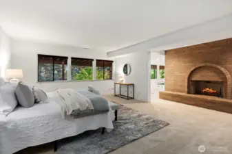 Luxe primary on lower level with fireplace and 5 piece bath