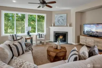 Family room with course view. Cozy gas fireplace and carpet.