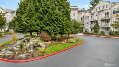 A beautiful water feature greets you at the entrance of the quiet cul-de-sac.