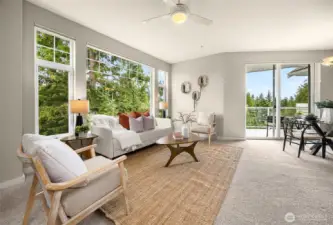 Open concept family room, kitchen and dining room. Doors lead to your private balcony.