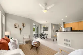 Open concept family room, kitchen and dining room. Doors lead to your private balcony.