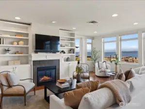 Custom built-in cabinetry surrounds the cozy gas fireplace . . .