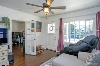 Living room with big windows drenched in natural light.