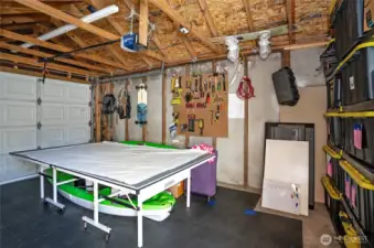 Inside of 1 car garage with ample space for car and tools