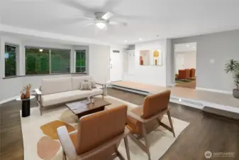 Living room with large windows virtually staged.