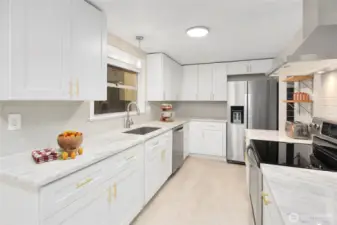 Updated kitchen with stainless steel appliances. Virtually Staged.