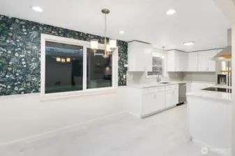 Eating nook steps to the kitchen and family room.