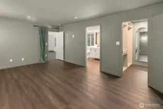Primary suite with adjoining three quarter bath and walk-in closet.