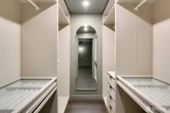 Luxurious primary walk-in closet.