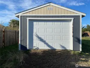 Garage with water spigot nearby