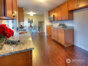 Kitchen with shaker cabinets and granite counters.