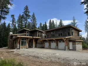 Image is of a Suncadia home being built, similar siding and stone for reference.