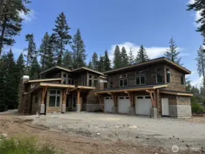 Image is of a Suncadia home being built, similar siding and stone for reference.