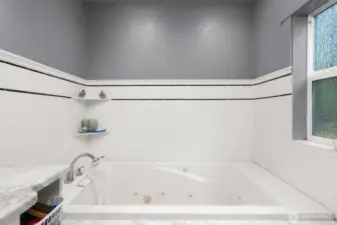 Mstr Bath, all tiled around the jetted tub.