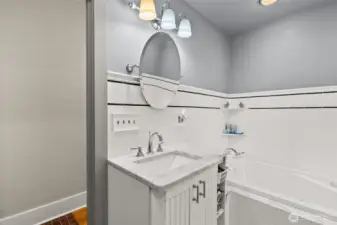 Main bath, mostly tile, jetted tub.