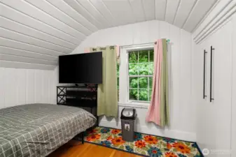 Second upstairs bedroom with plenty of closet. Hardwood floor