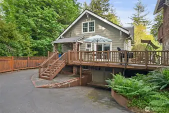 Back of the house with large deck to enjoy.  Lower level used to be the garage.  ADU to the right.