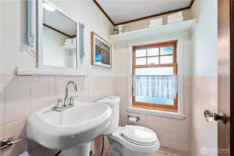 Glass door knobs and millwork; even the powder room on the main level has character!