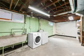 Large unfinished basement with high ceiling, lots of storage and tons of potential!