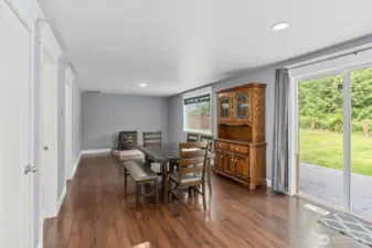 Dining and Family Rooms with Access to Half Bath and Laundry Room