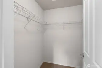 Walk-in closet in the Primary Suite.