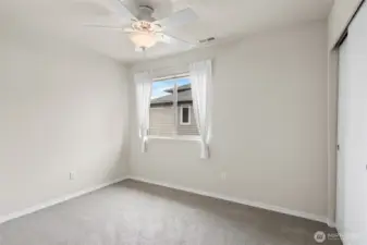 One of two guest bedrooms, both located on the upper level.