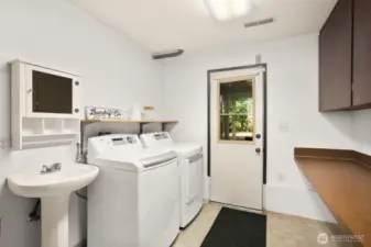 Half bath and laundry room lead to separate entrance