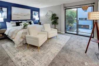 MASSIVE primary bedroom with partial water view from bed.