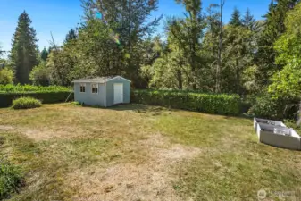 The yard extends beyond the hedge in the back - go explore and find the creek!  Great for outdoor adventures.