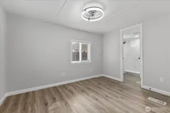 Primary Bedroom with En Suite Bathroom and Walk-in Closet