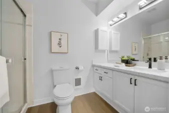 New floors, quartz counters and fixtures in the 3.4 bath.