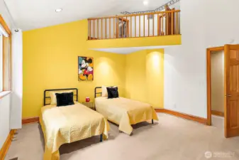 Secondary bedroom with loft balcony.