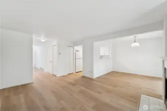 Living area w/ view from fireplace to entry way