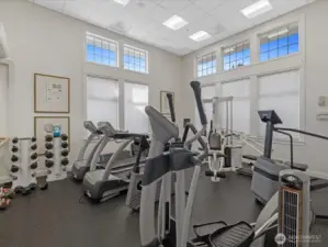 On-site fitness center with cardio equipment, free weights, and dedicated workout space within the community.