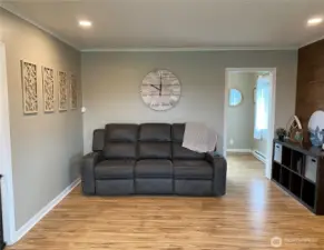 lanother view of living room with door to front room.