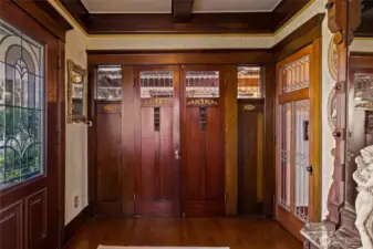 Doors from the entry in closed position to the living room.