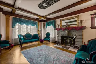 Large windows offer great natural light.  Classic swag & jabot drapes.