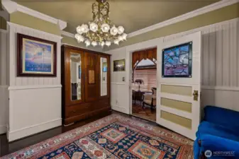 Bedroom #3 on the second floor. Open doorway leads to elevator access and large window overlooking rear of the home.