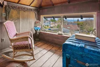 Great sitting area by the window with views of Commencement Bay, Olympic Mtns & Browns Point.  Night view is magical.