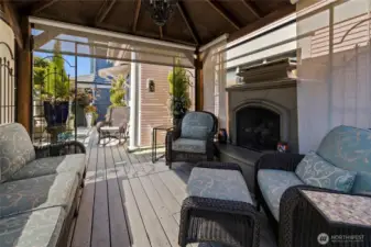 Gazebo with electric shades & gas fireplace is the ultimate in comfort.