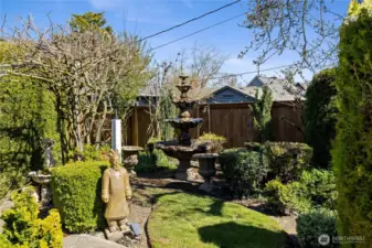 Side yard with additional fountain & interest.