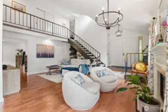 Dramatic staircase and upen upstairs hallway