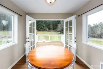 Bright and sunny breakfast/dining area directly off kitchen with French doors to the deck. Perfect for those spring, summer fall outdoor dining.