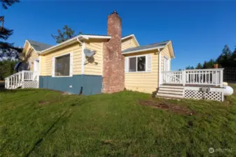 South side of house with attached deck of breakfast rsunroom.