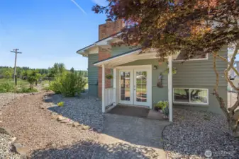 The covered front porch offers a warm and inviting welcome, creating the perfect spot to greet guests. Complementing this charming entry is the updated low maintenance landscaped front yard, which adds a fresh touch to the home’s curb appeal