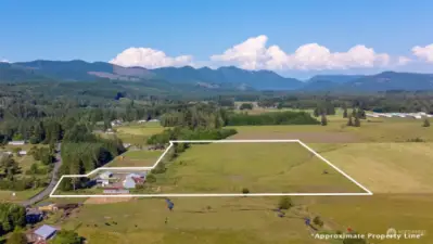 The perfect location with lush pastures and lots of barn space for your animals with Kearney Creek meandering through the farm. Also a 4 bedroom home  and shop the possibilities of this farm property are endless. What are your dreams.