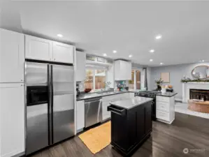 Open kitchen with granite counters & lots of storage space