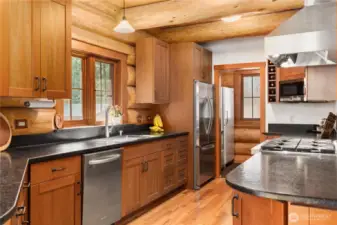 Beautiful soft close cherry cabinetry.